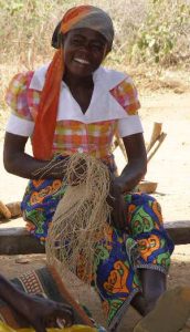 Lady weaving baobab fibers